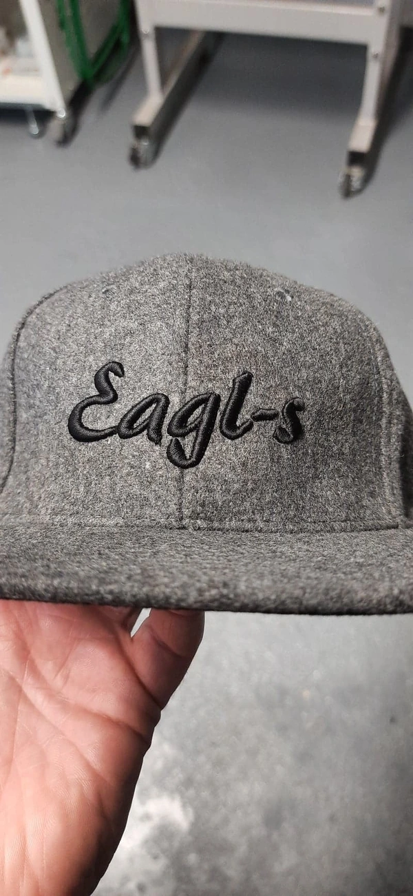 3D puff embroidery to grey peaked cap