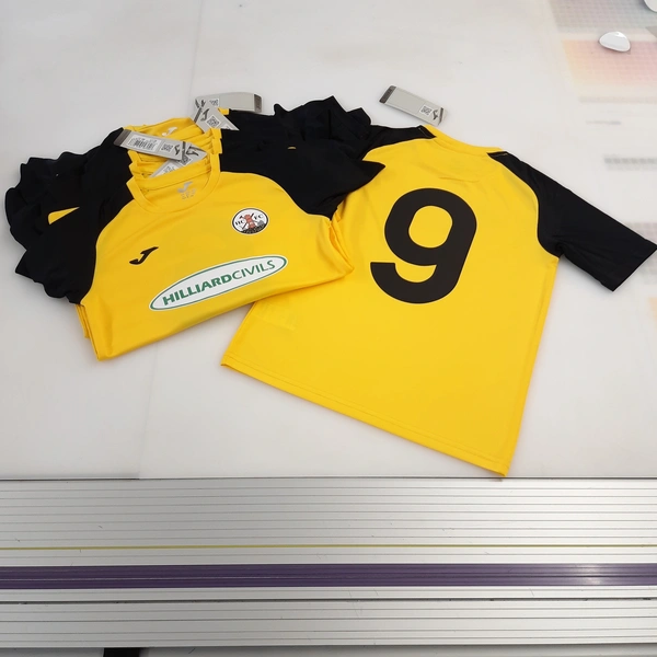 Printed Junior football kit including team badge, sponsor and number